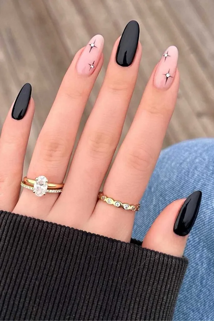 Black and sheer nails with stars