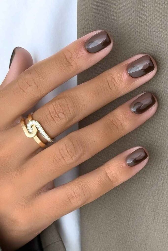 Brown and taupe short mani with swirl design
