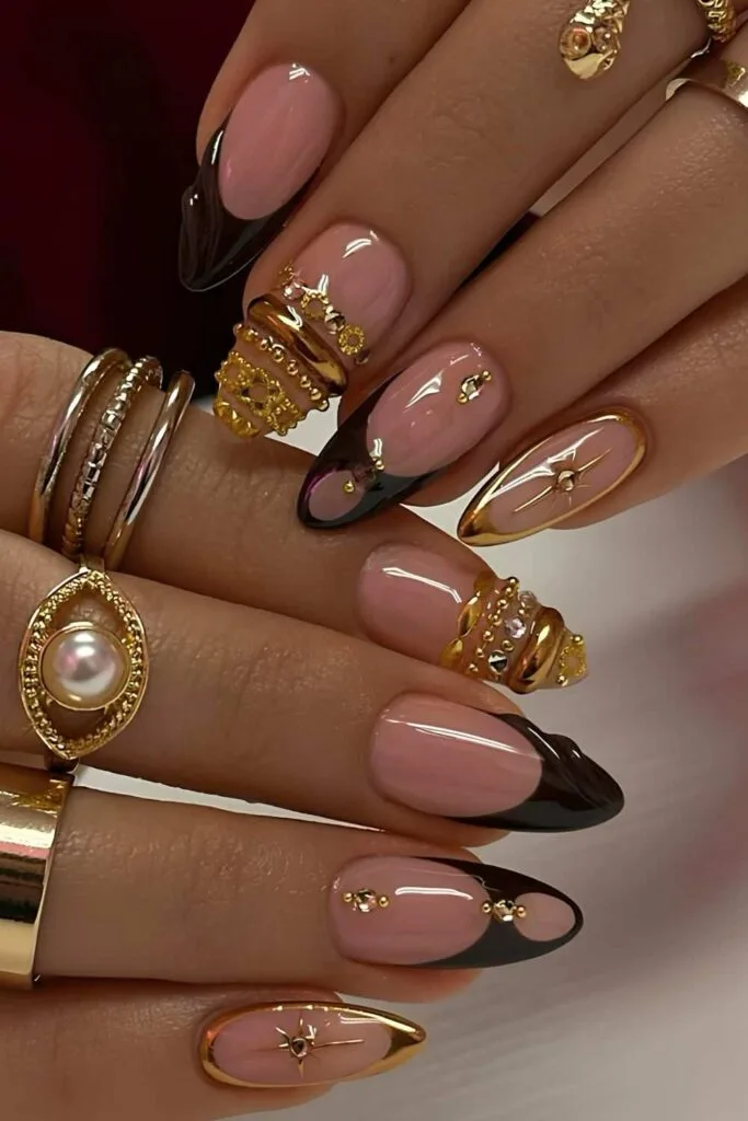 Dark brown and metallic gold nails with bangle art