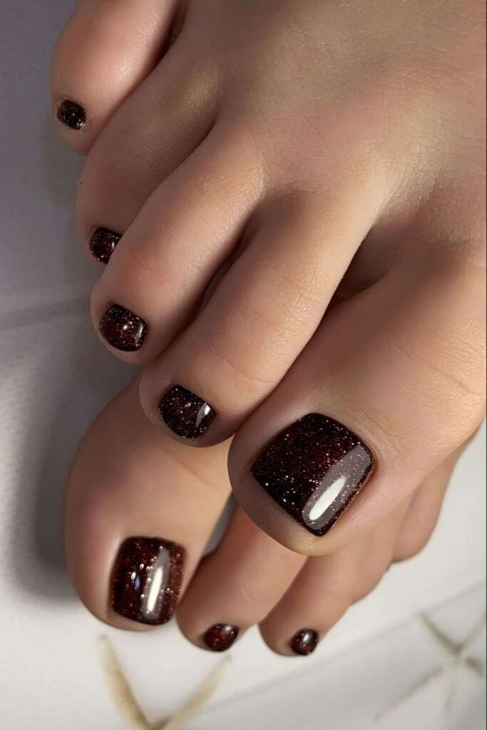 Dark brown shimmery pedicure