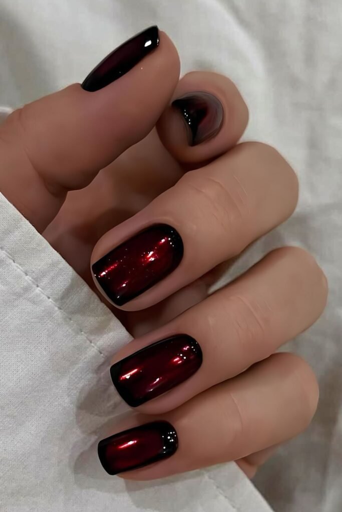Dark red and black mani with chrome finish