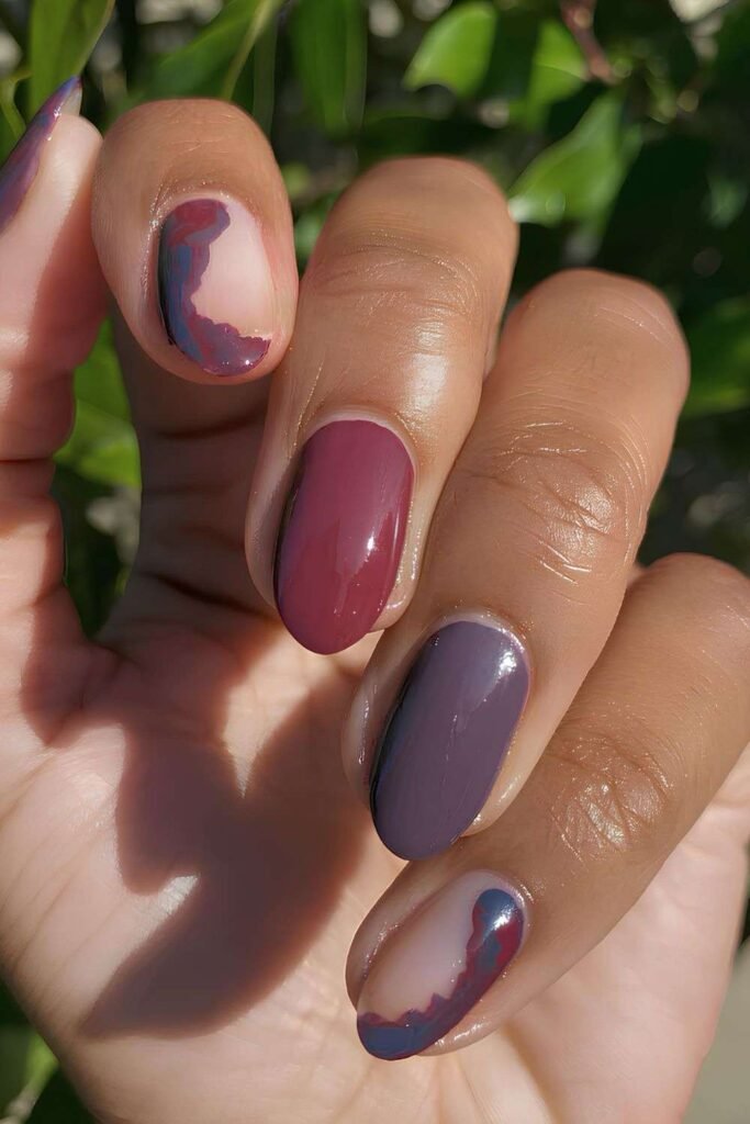 Dark red and dusty purple mani with marbled negative space