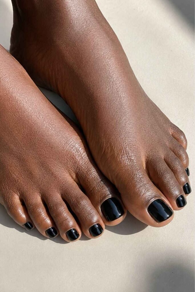 Glossy black pedicure