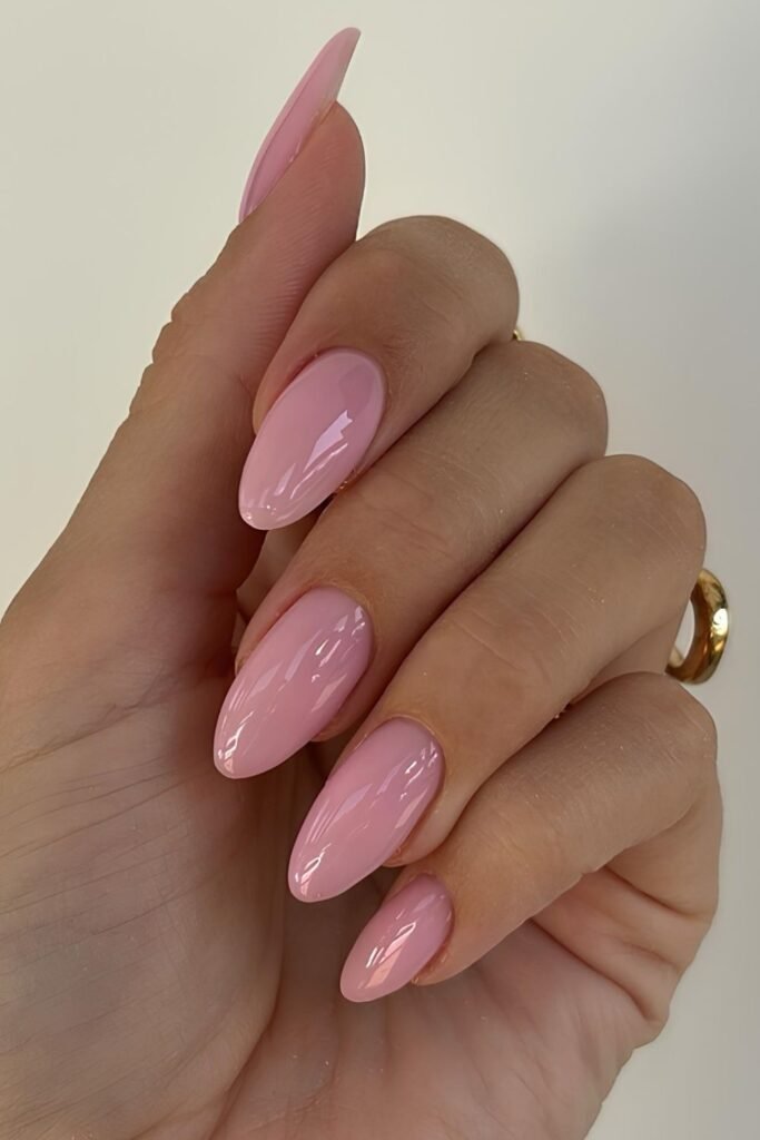 Glossy pink sorbet nails with a soft jelly-like finish