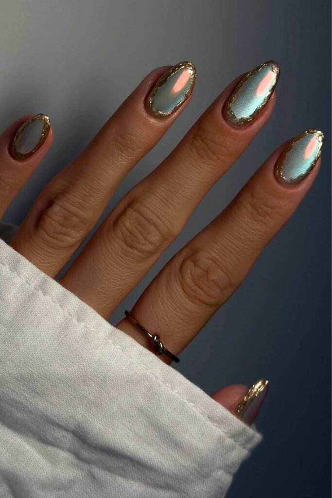 Light blue cat-eye nails with gold chrome rings