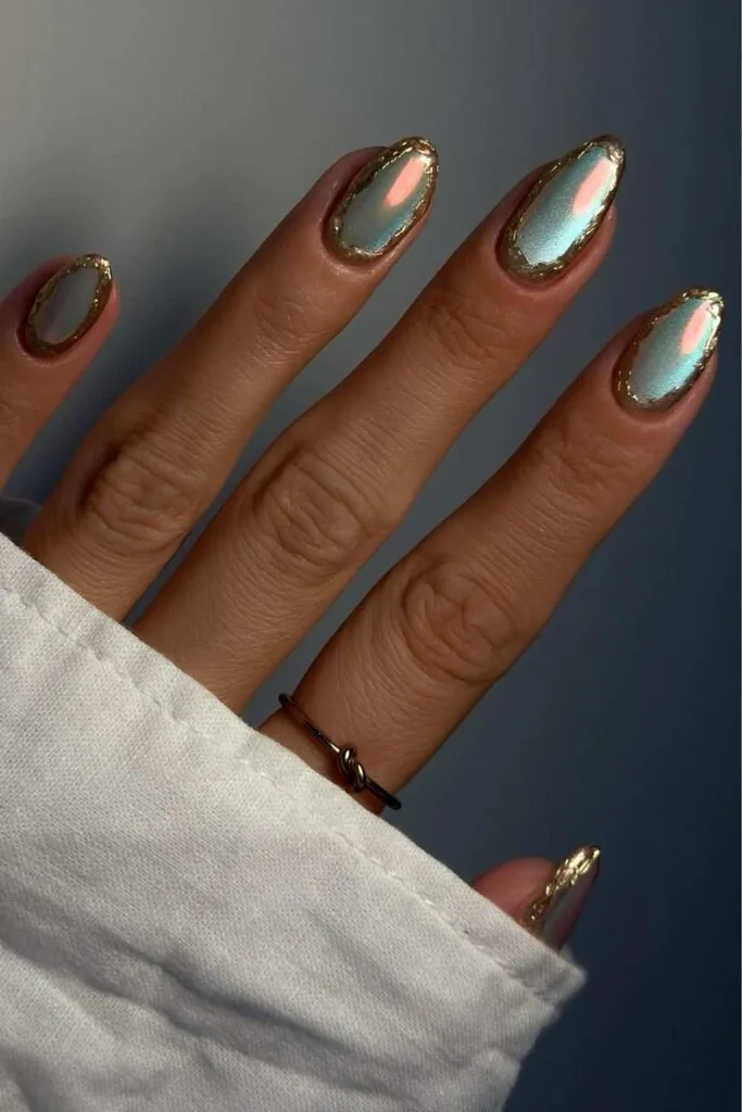 Light blue cat-eye nails with gold chrome rings
