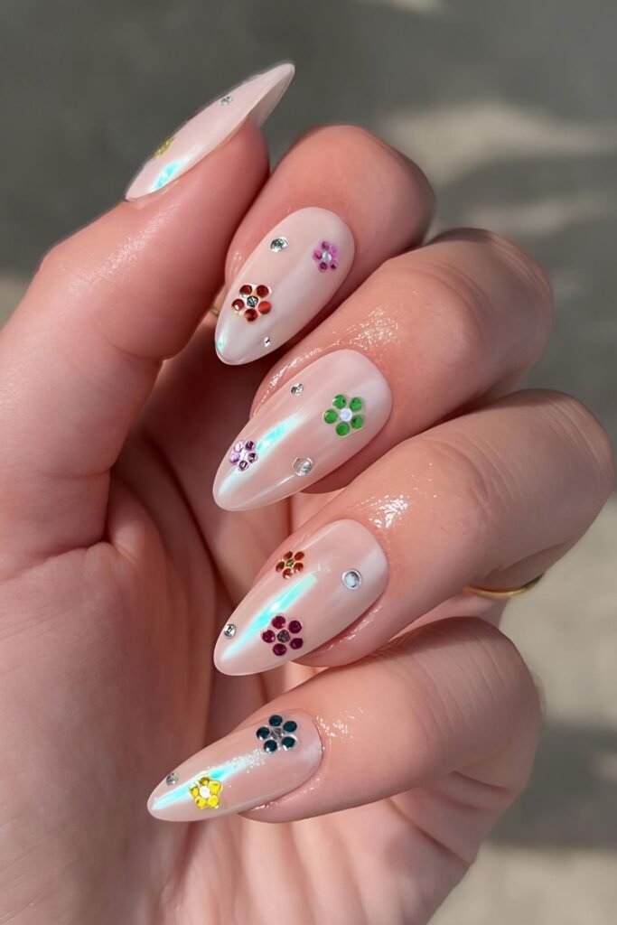 Neutral chrome nails with studded floral accents