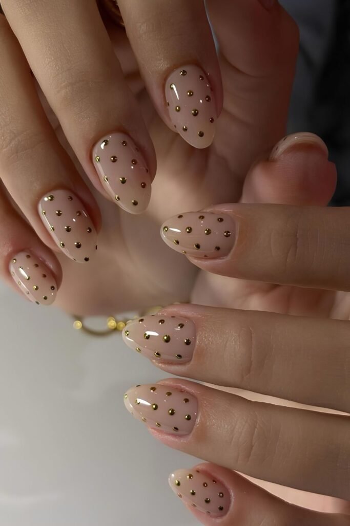 Neutral nails with gold chrome dots