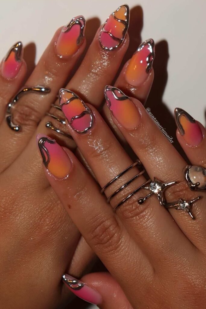 Pink and orange sorbet nails with silver chrome nail art