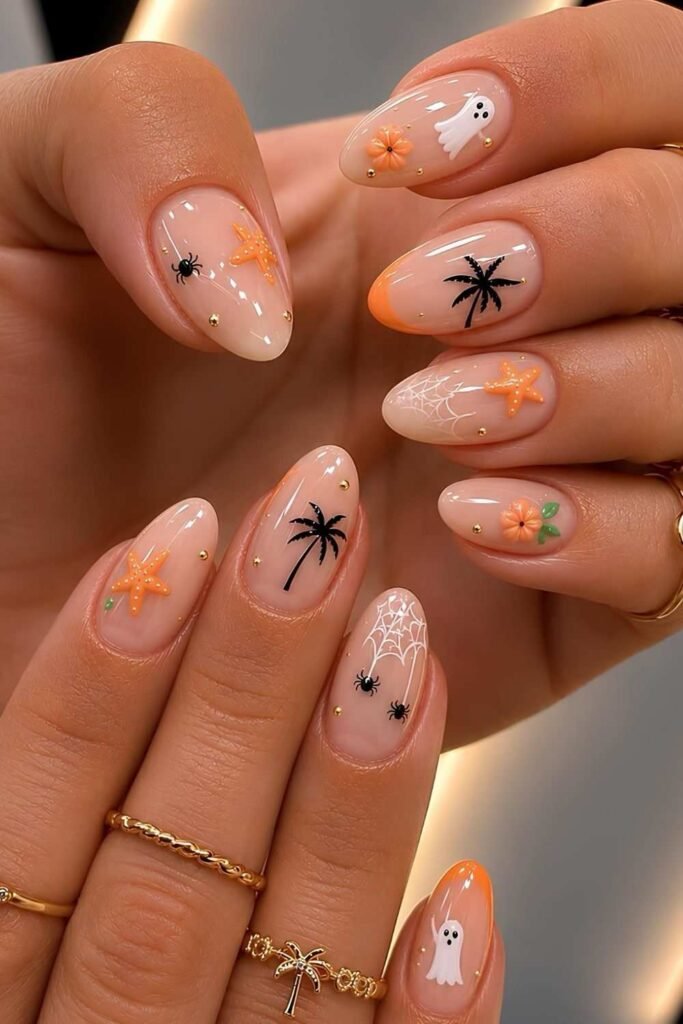 Sheer nails with orange, black and white halloween accents