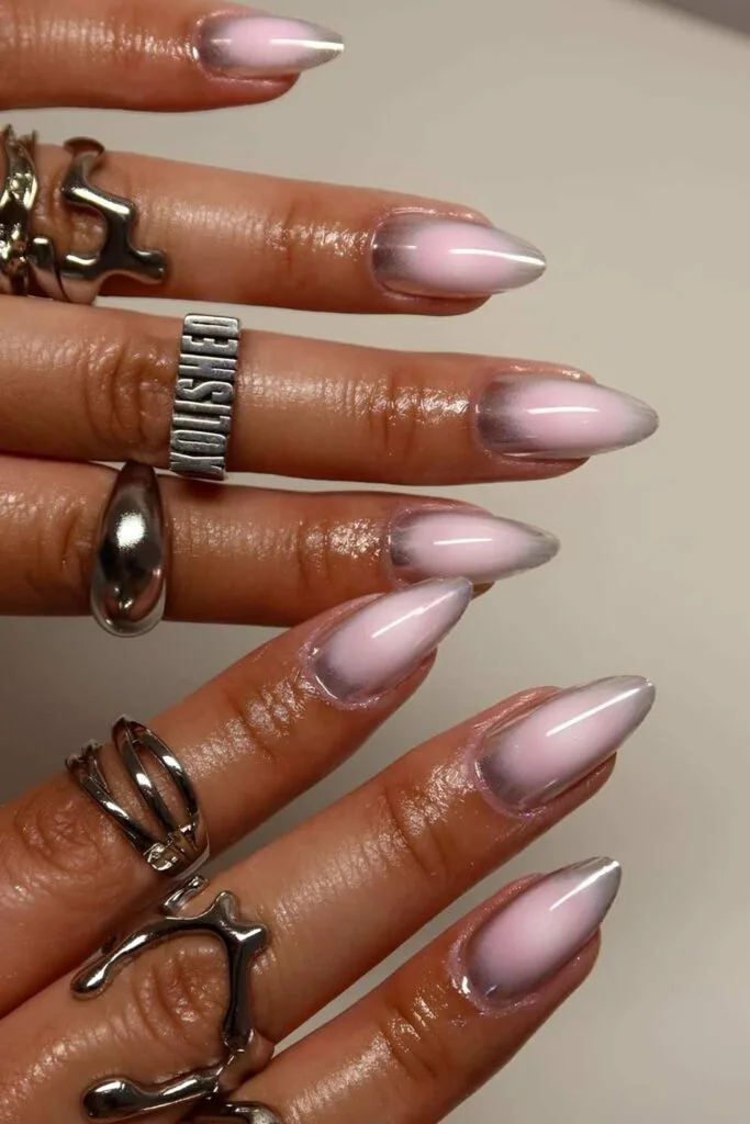 Silver chrome nails with light pink aura effect