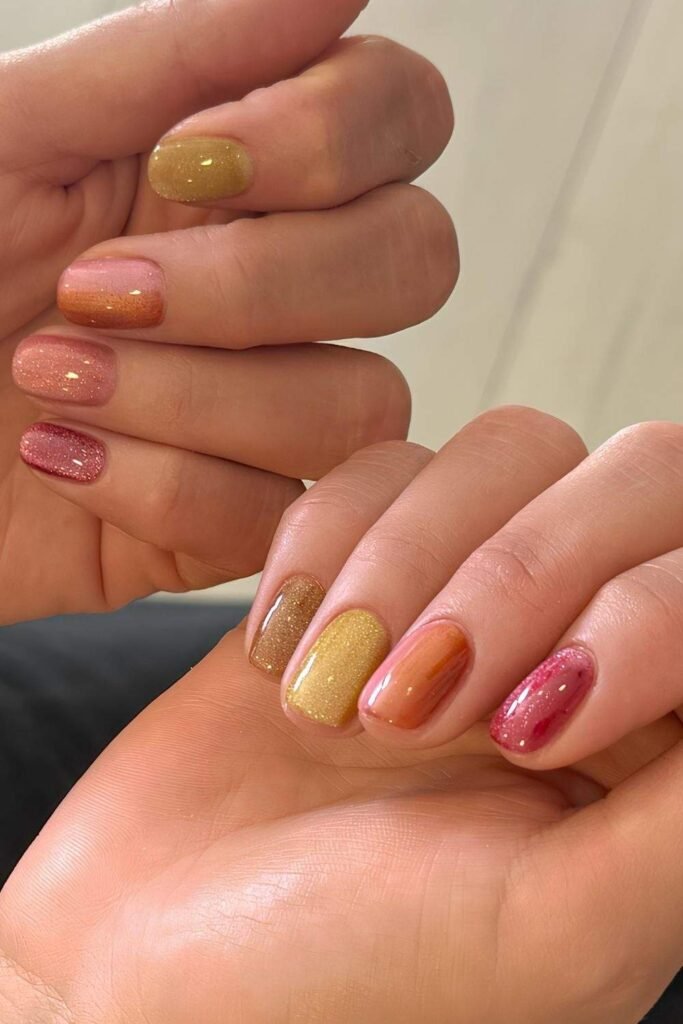 Sorbet cat-eye nails in pink, orange, yellow and berry shades