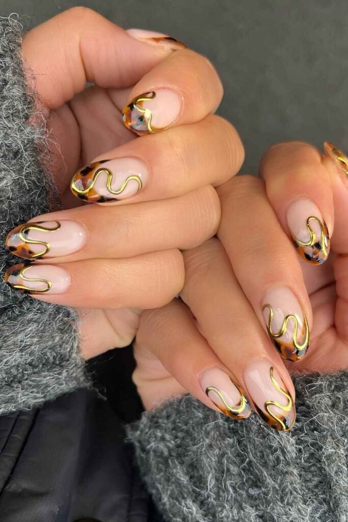 Tortoise shell French nails with gold swirls