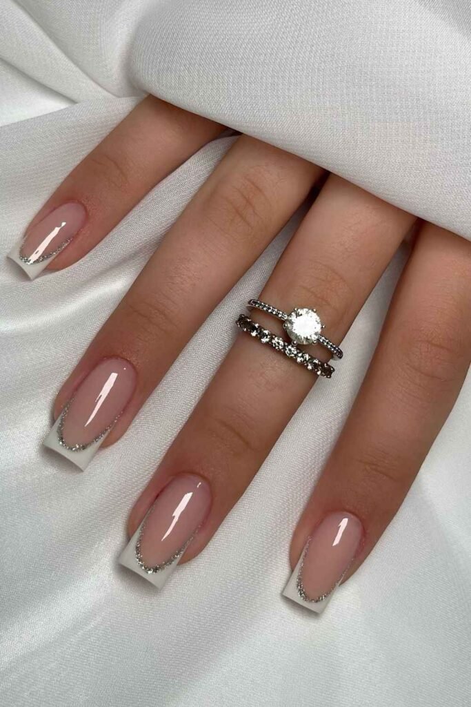 White French nails with glitter outline