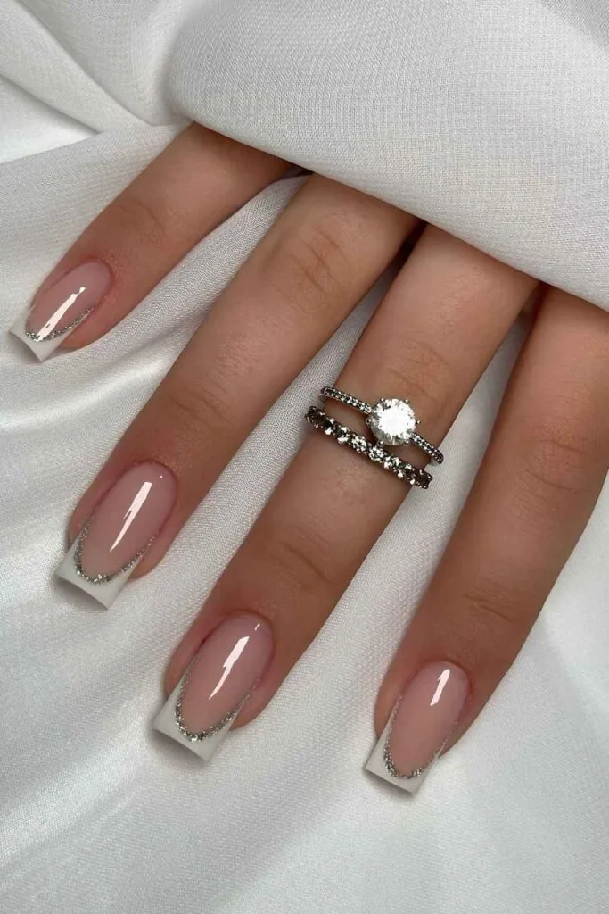 White French nails with glitter outline
