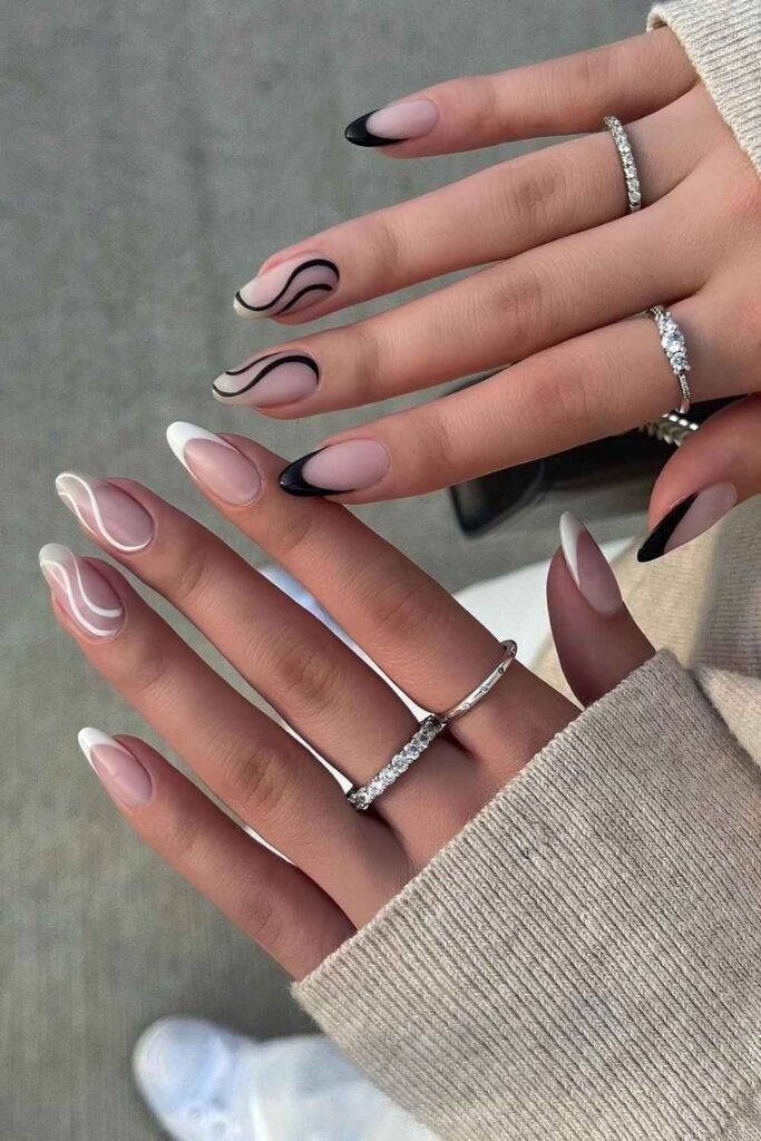 Black and white French nails with swirls