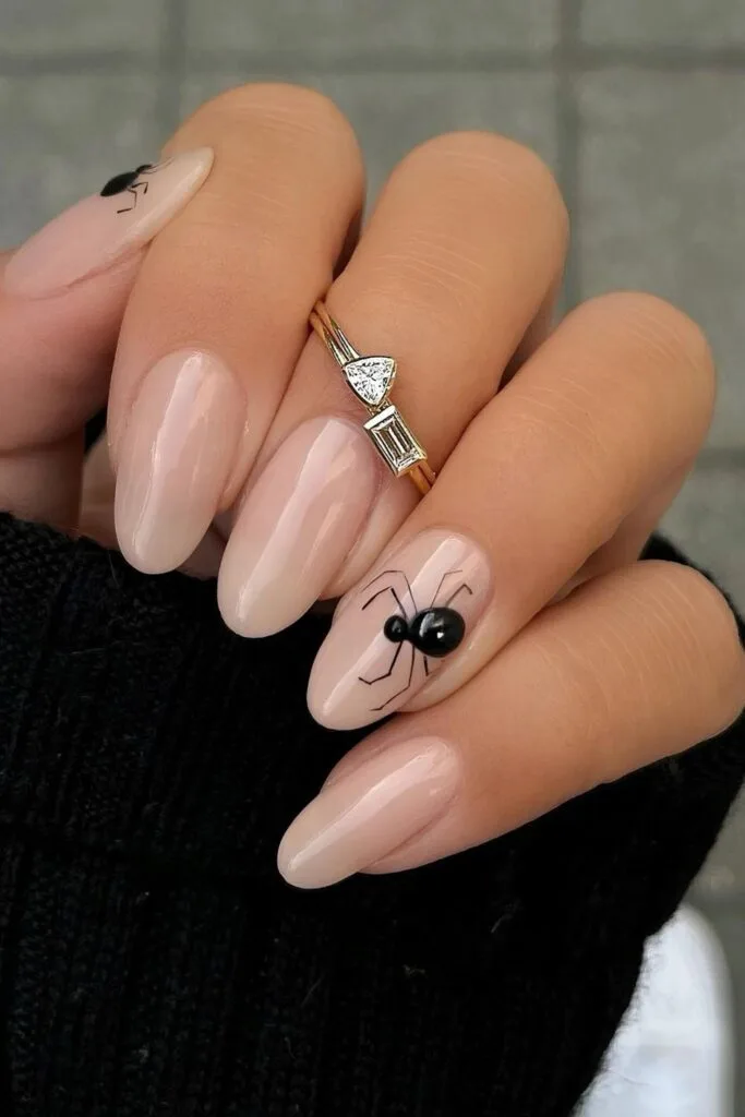 Black widow spider accent nails