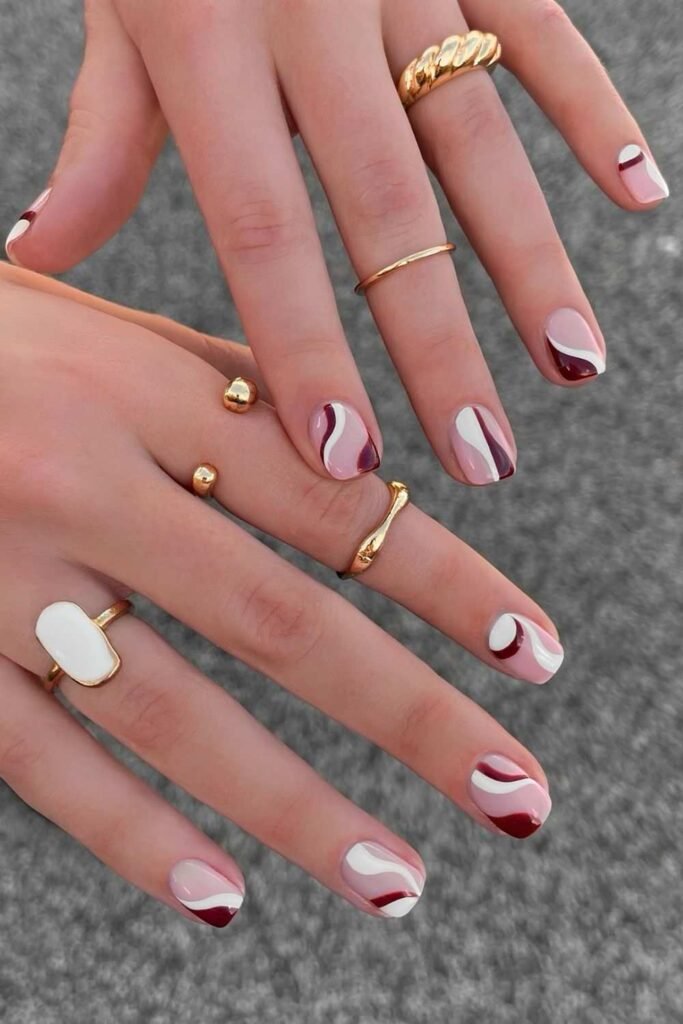 Brown and white swirly short nails