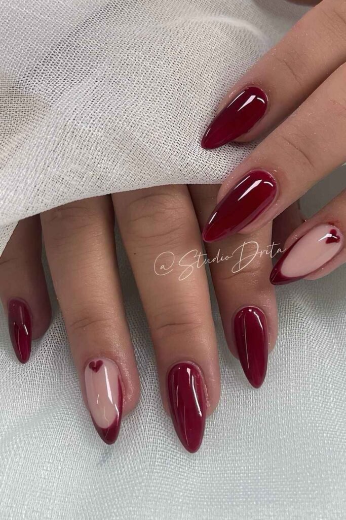 Burgundy nails with French and heart accent