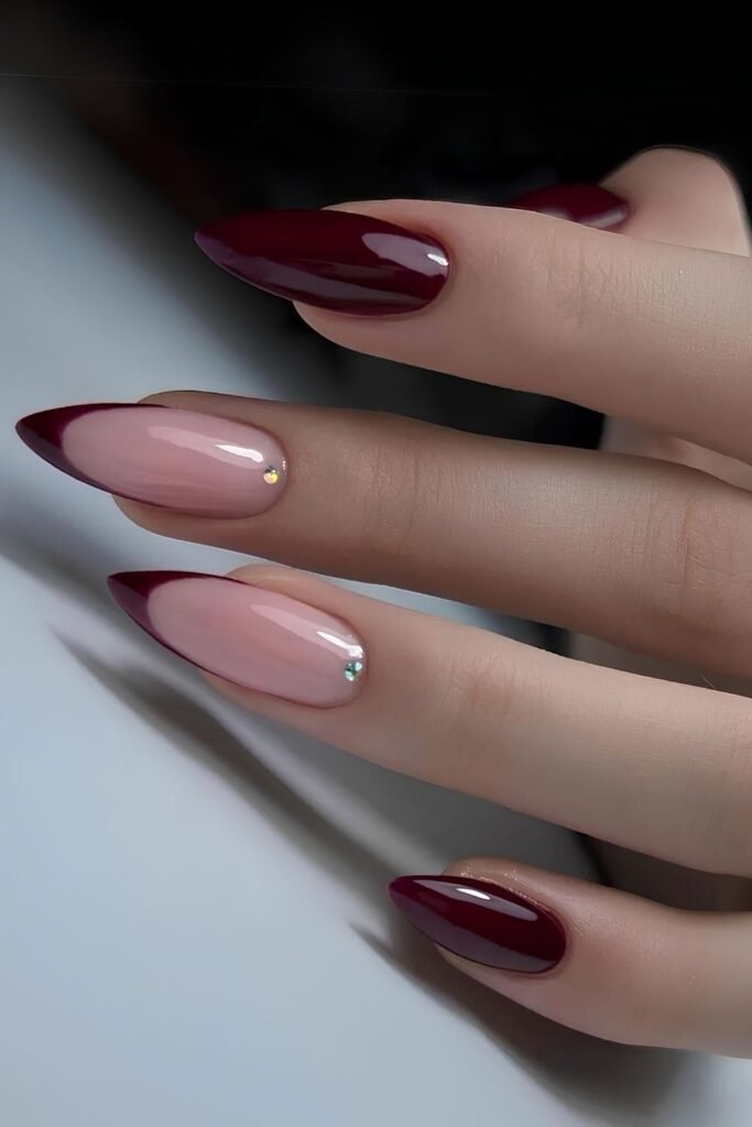 Burgundy nails with French tip accents and crystals