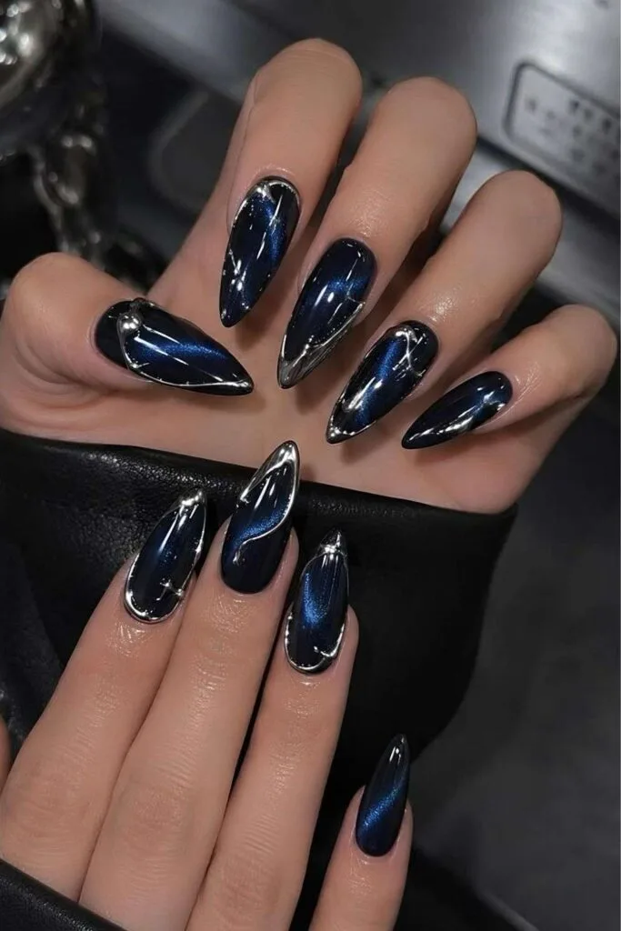 Dark blue cat eye nails with metallic silver