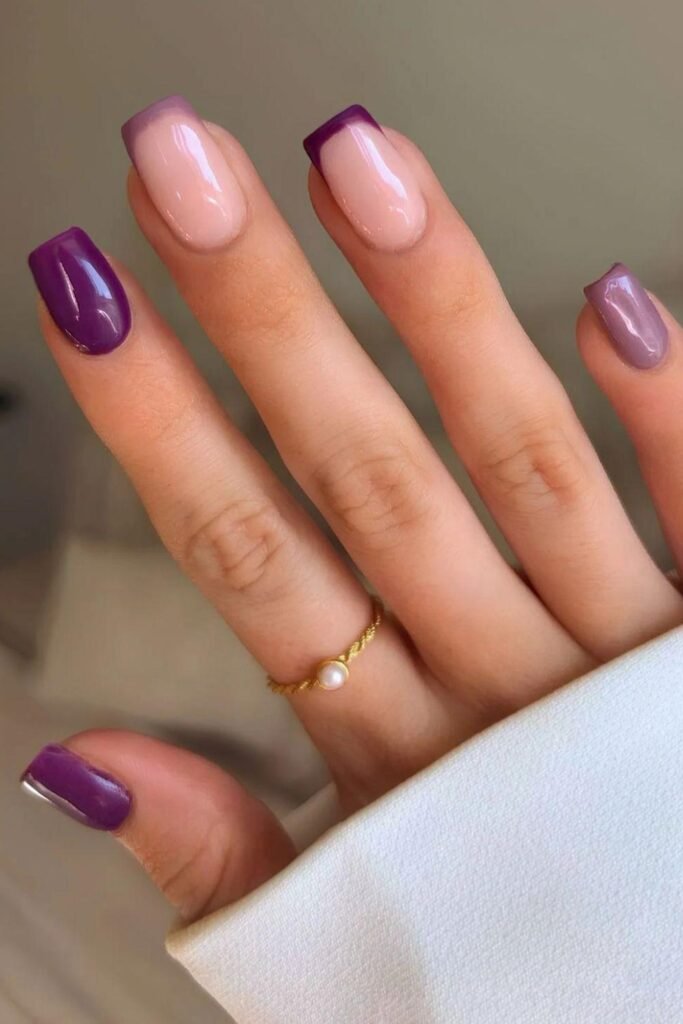 Dark purple nails with French tip accents