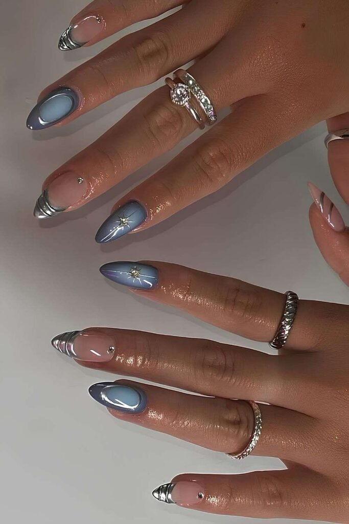 Light blue aura nails with silver chrome accents