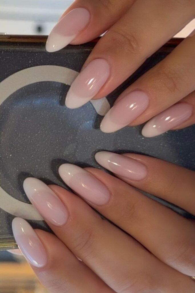 Long almond nails with glossy pink and white ombré tips