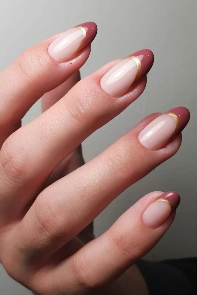 Mauve French nails with gold outline