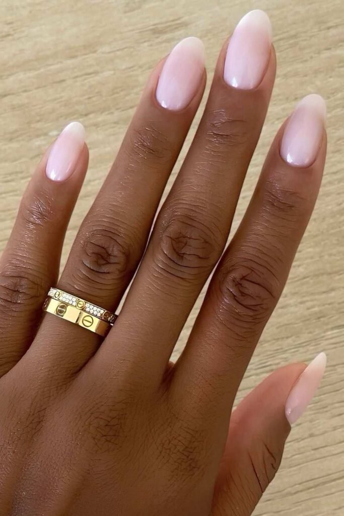 Milky white foggy French nails on dark skin
