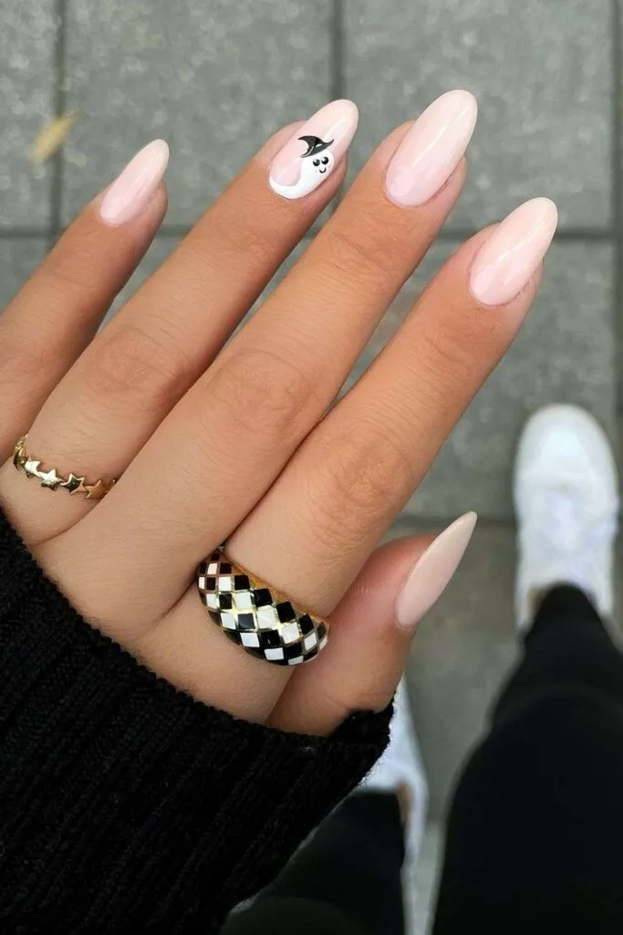 Milky white nails with tiny ghost