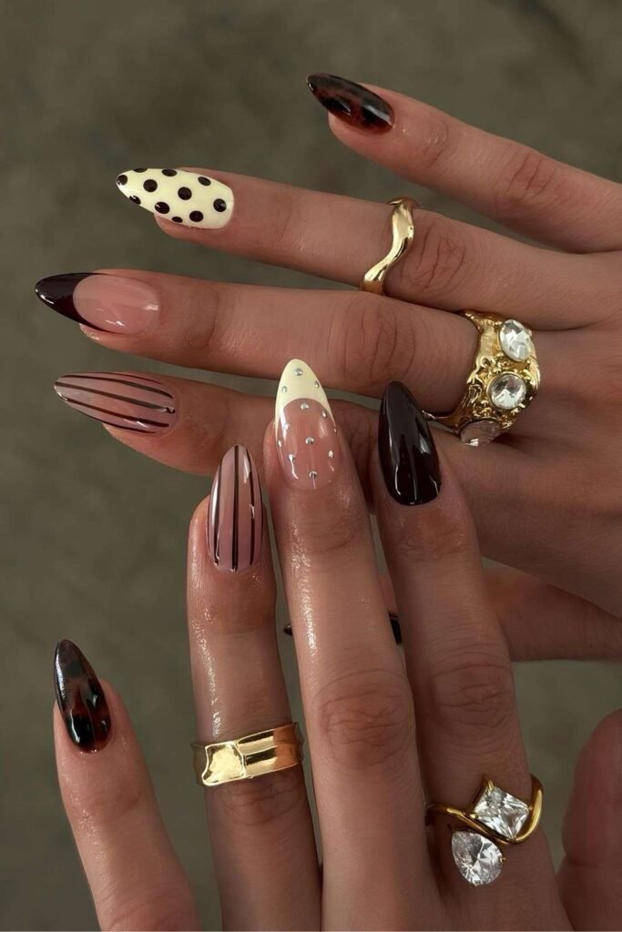 Mismatched fall nails with brown nail art