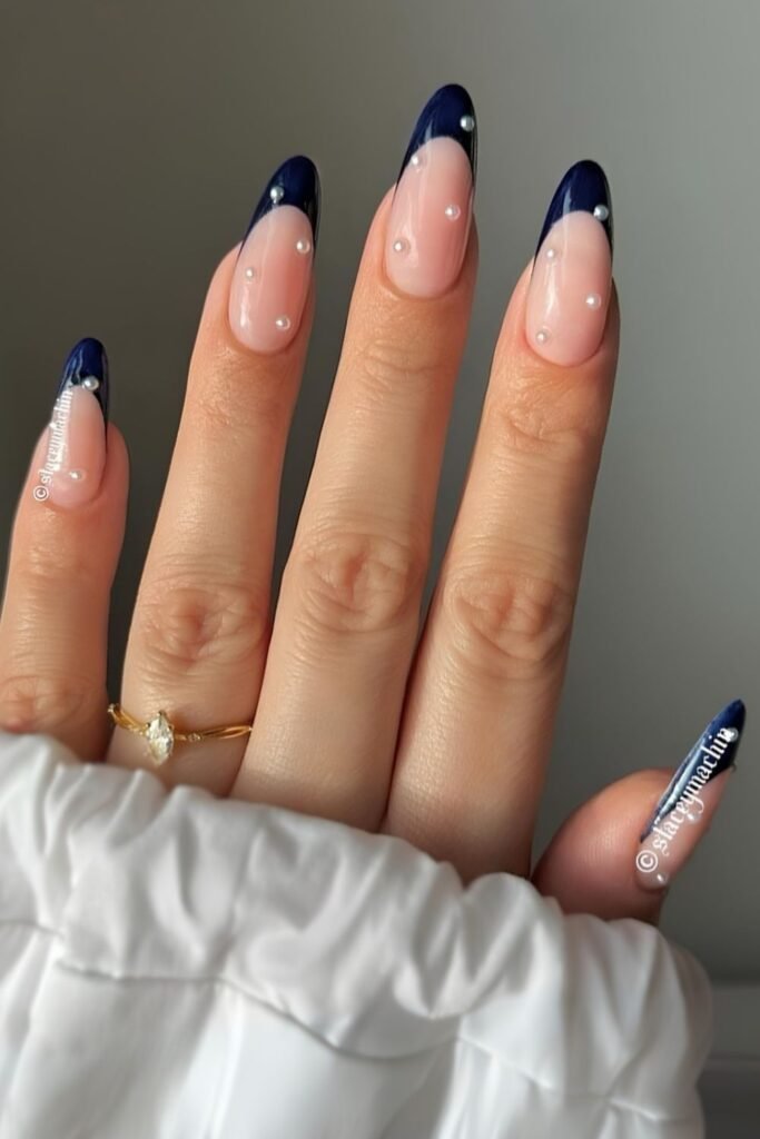 Navy French nails with pearl accents