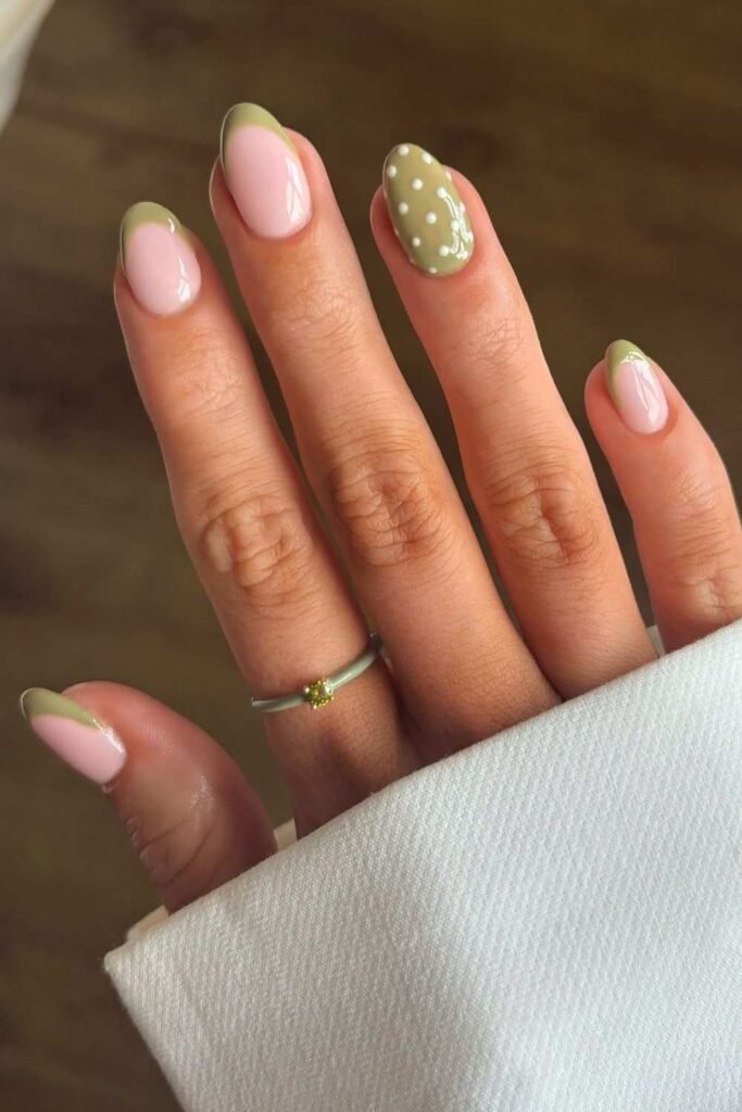 Olive green French mani with polka dot accents