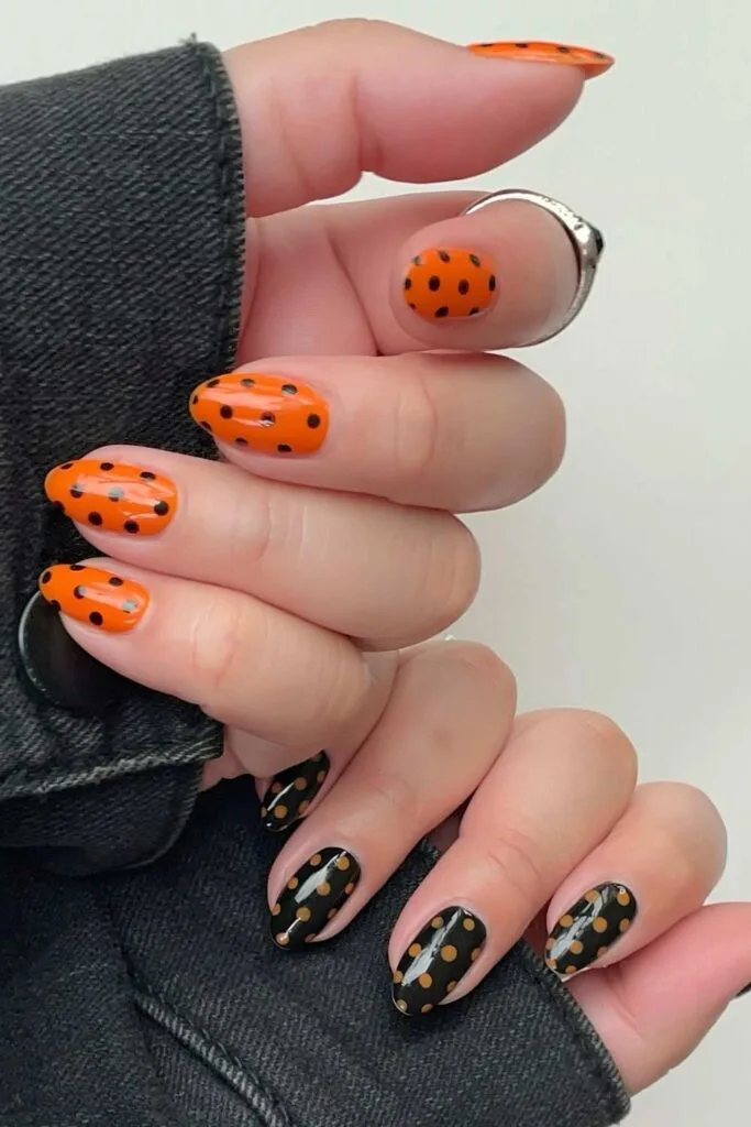 Orange and black polka dot nails