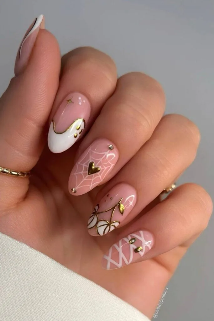 Pink Halloween nails with gold details