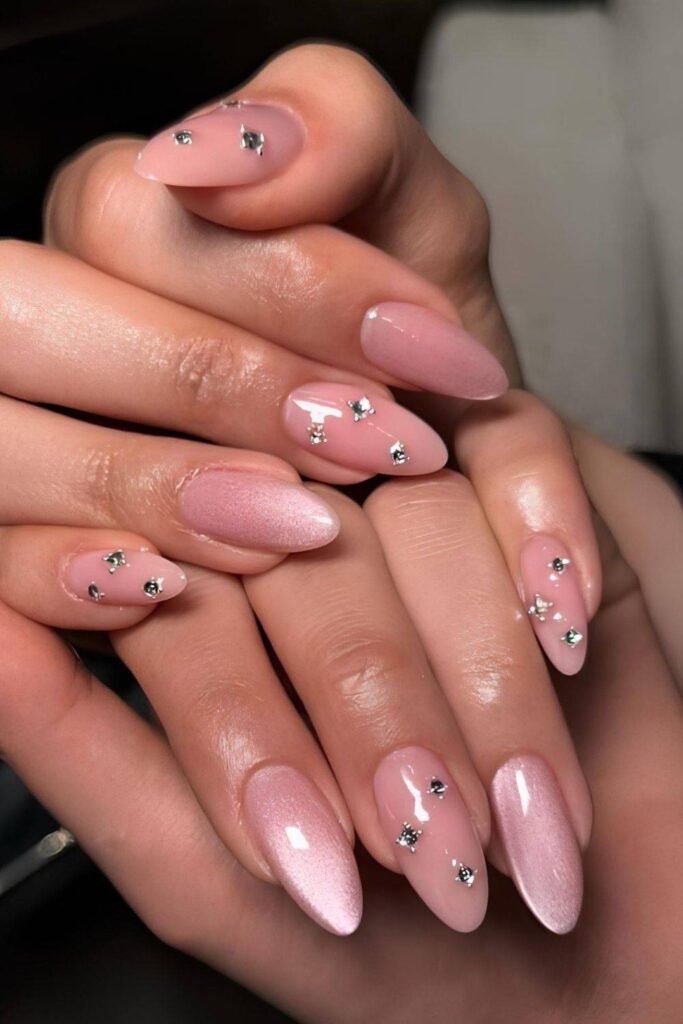 Pink cat-eye almond mani with crytsal accents
