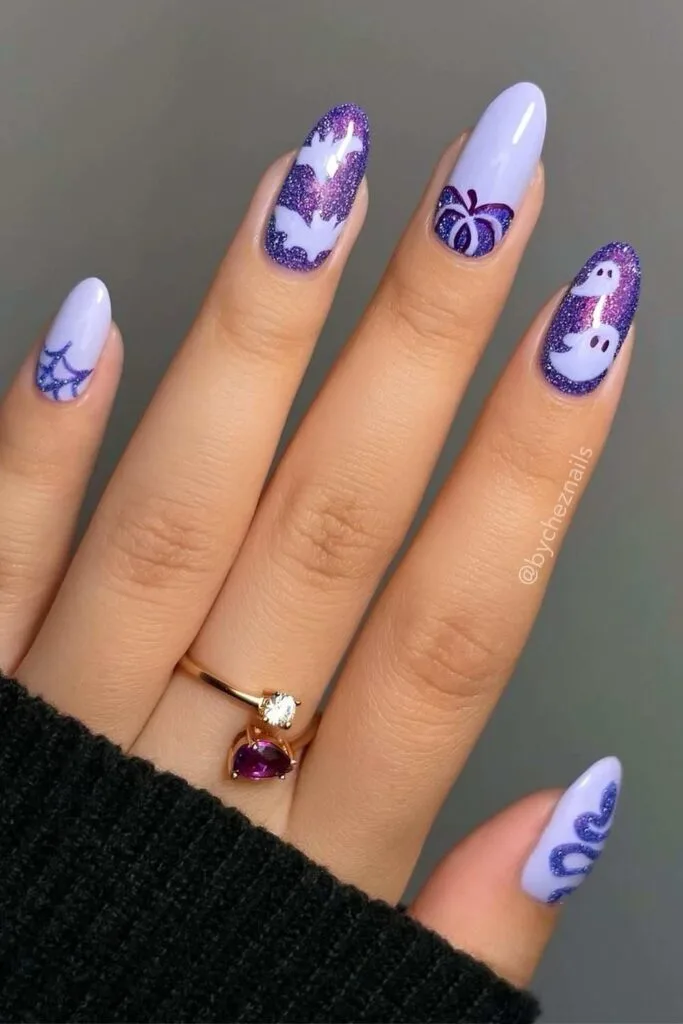 Purple Halloween nails with glitter details