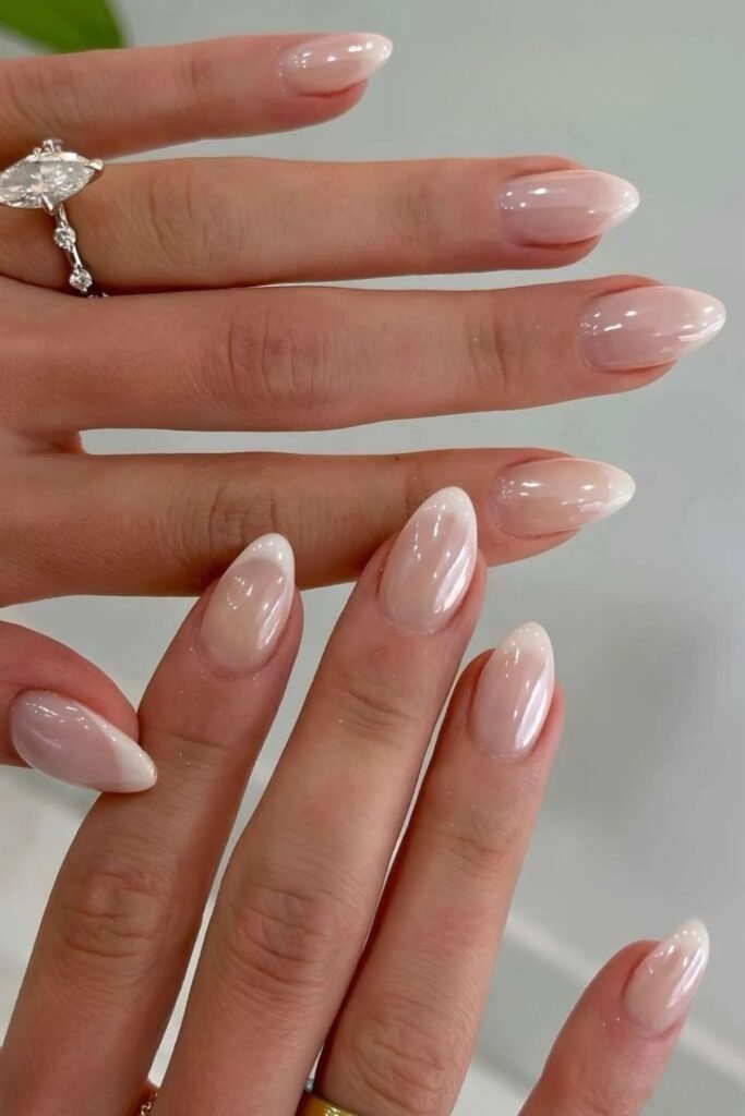 White pearlescent chrome nails with a glossy finish